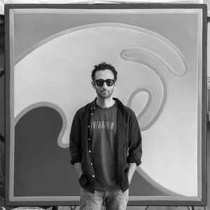 A portrait photograph of Alex Israel